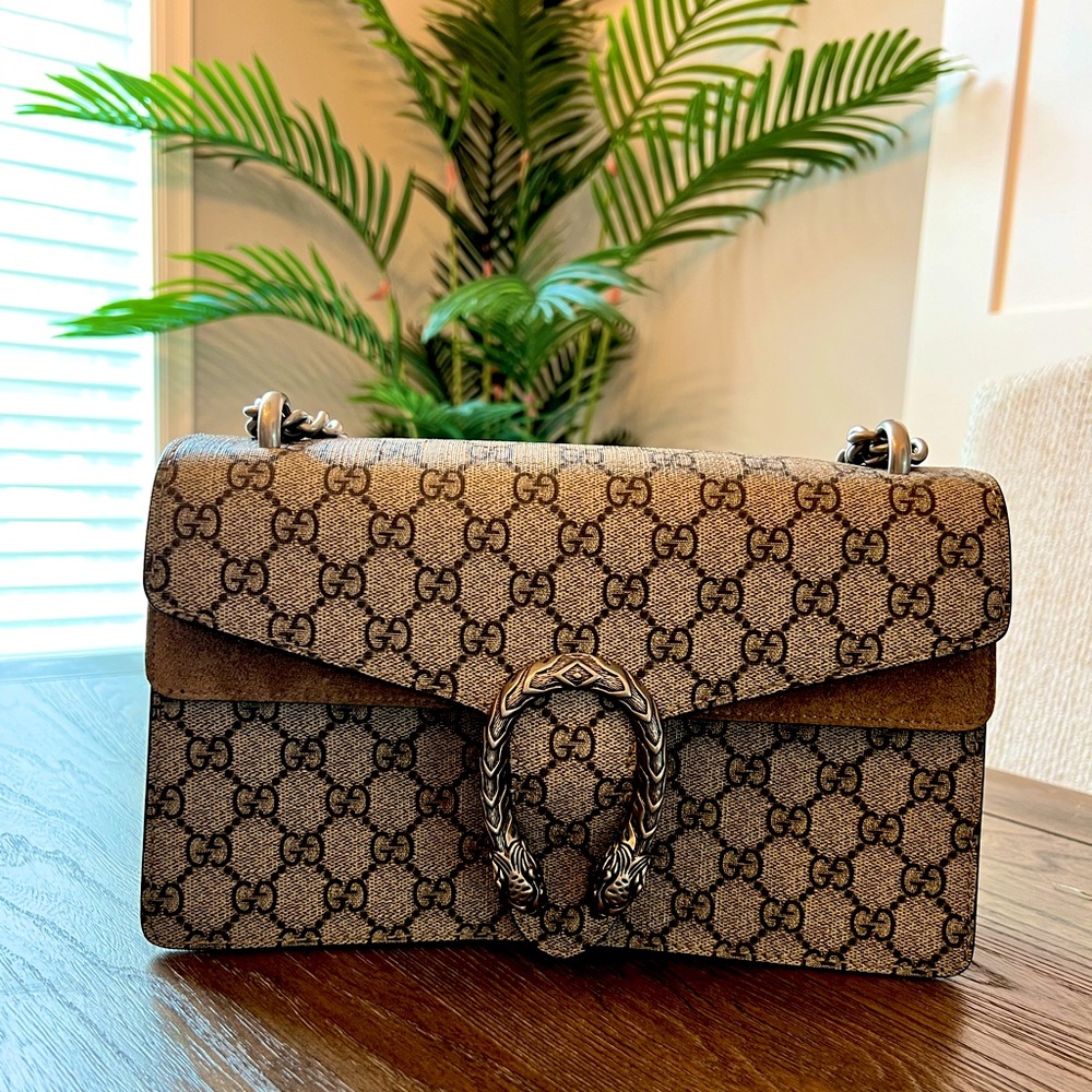 The small Dionysus shoulder bag with signature GG pattern and suede details.